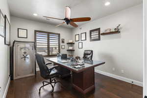 Office featuring baseboards, visible vents, ceiling fan, and dark wood-style flooring