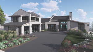 View of front of house featuring concrete driveway, an attached garage, a chimney, and stucco siding