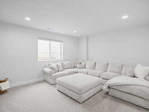 Theatre/media room with included sectional and large screen TV, also wired for Dolby Atmos system