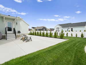 View of patio featuring a residential view, entry steps, and prvacy fence