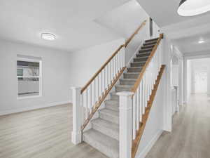 Sitting room off of the entry and stairway to second level