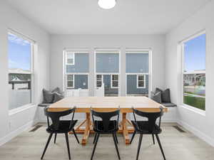 Light and bright dining surrounded by windows