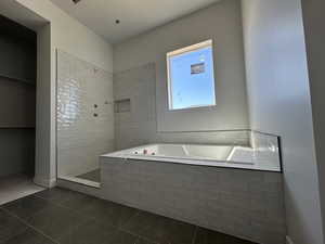 Full bathroom with a bath, walk in shower, and tile patterned floors