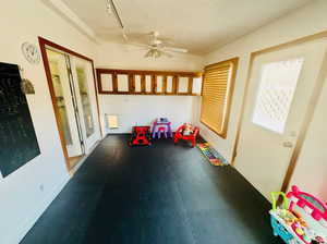 Unfurnished sunroom featuring rail lighting