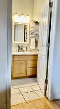 Bathroom featuring vanity and tile patterned flooring