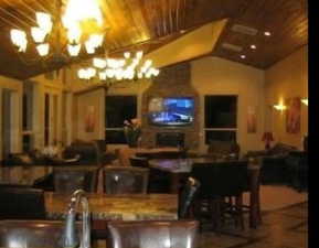 Dining area featuring a chandelier and vaulted ceiling