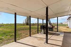 View of patio with fence