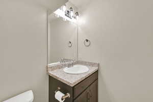 Bathroom featuring toilet and vanity