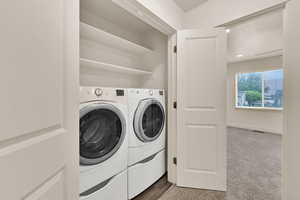 Laundry area featuring laundry area, washer and clothes dryer, visible vents, and recessed lighting