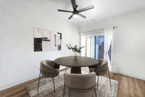 Dining area featuring baseboards, wood finished floors, and ceiling fan