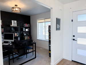 Office space featuring baseboards and visible vents