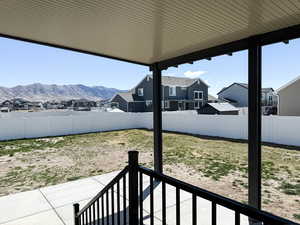 View of yard with a residential view, a fenced backyard, and a patio