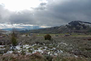 Property view of mountains with a rural view