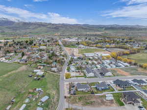 Drone / aerial view with a residential view and a mountain view