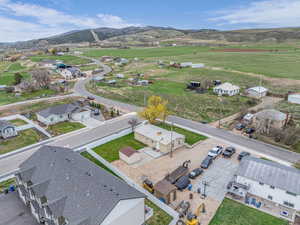 Drone / aerial view featuring a mountain view and a residential view