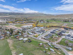 Birds eye view of property featuring a mountain view and a residential view