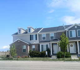 View of property featuring brick siding