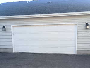 Garage with aphalt driveway