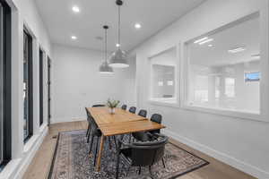 Dining space with view of indoor basketball court