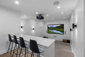 Cinema with recessed lighting and baseboards