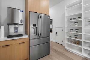 Walk in pantry with grocery pass through door from garage
