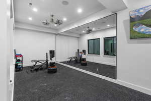 Exercise area featuring baseboards, visible vents, and recessed lighting