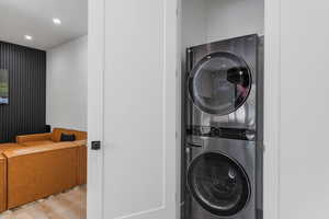 Outdoor living area with Laundry area featuring stacked washer and dryer