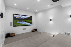Carpeted cinema featuring recessed lighting, baseboards, and visible vents