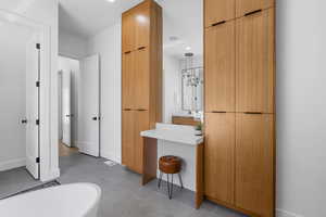 Primary Bathroom featuring recessed lighting, tile patterned floors, and baseboards
