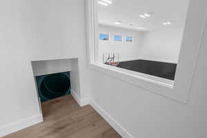 Sliding tube entrance off main floor goes down to the indoor basketball court