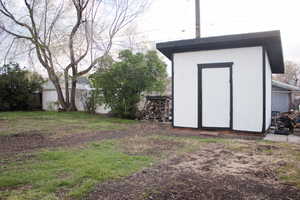 View of shed with fence