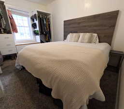 Bedroom with carpet floors and a closet