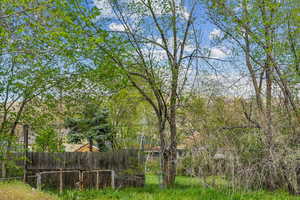 View of yard with fence