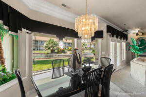 Dining room with visible vents and an inviting chandelier