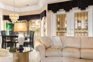 Living area with a chandelier and french doors