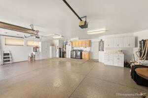 Garage featuring a garage door opener