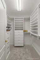 Spacious closet featuring radiator