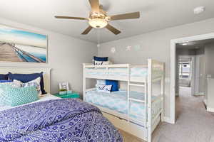 Bedroom with carpet floors, a ceiling fan, and baseboards