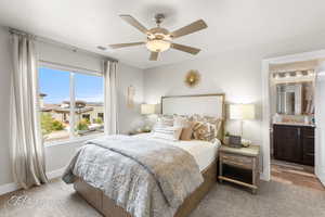Bedroom featuring visible vents, carpet flooring, baseboards, and a ceiling fan