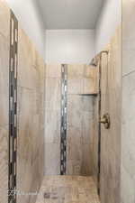Full bathroom featuring tiled shower