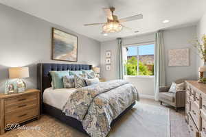 Carpeted bedroom with baseboards, visible vents, recessed lighting, and ceiling fan
