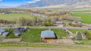 Birds eye view of property featuring a rural view and a mountain view