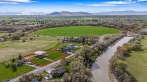 Birds eye view of property featuring a mountain view and a rural view