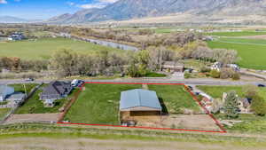 Bird's eye view with a rural view and a water and mountain view