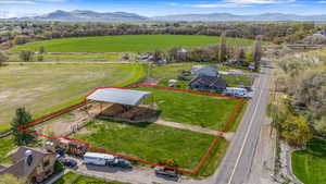 Drone / aerial view with a mountain view and a rural view