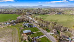 Aerial view featuring a rural view and a mountain view