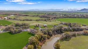 Birds eye view of property with a rural view and a water and mountain view