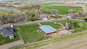 Birds eye view of property with a rural view and a water view