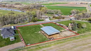 Aerial view featuring a water view and a rural view