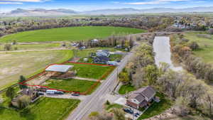 Aerial view featuring a rural view and a mountain view